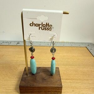 Faux turquoise long silver tone dangle earrings with red accent bead